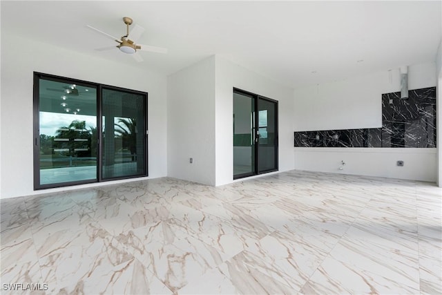 interior space featuring ceiling fan