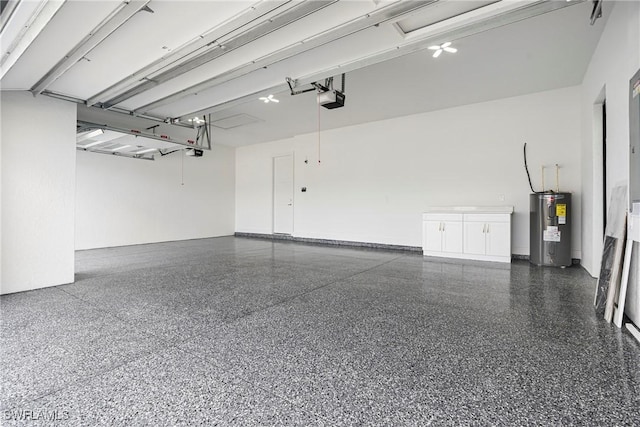 garage featuring electric water heater and a garage door opener