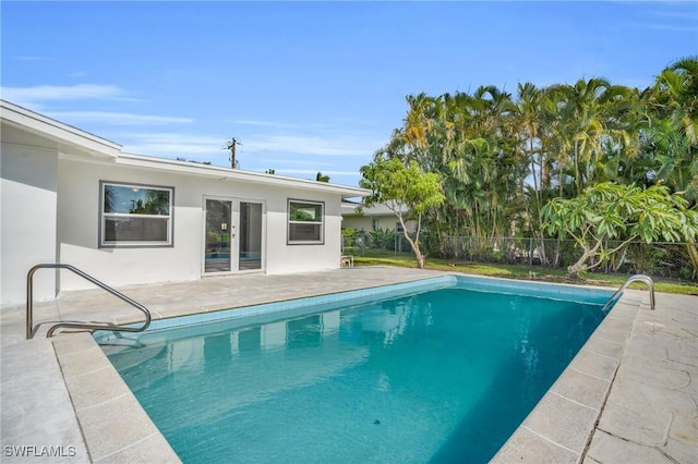 view of pool with a patio, fence, and a fenced in pool