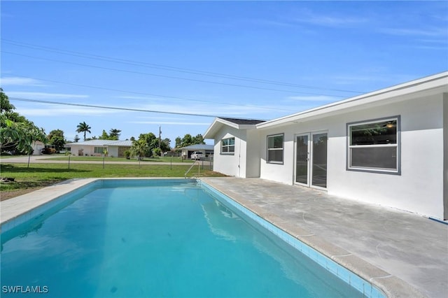 pool with a yard, a patio area, and fence