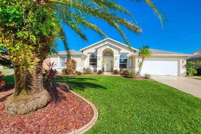 view of front of house with a front yard and a garage