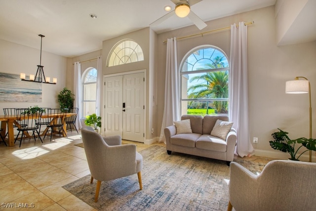 living room featuring ceiling fan and light tile patterned flooring