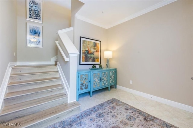 stairs featuring tile patterned floors and crown molding