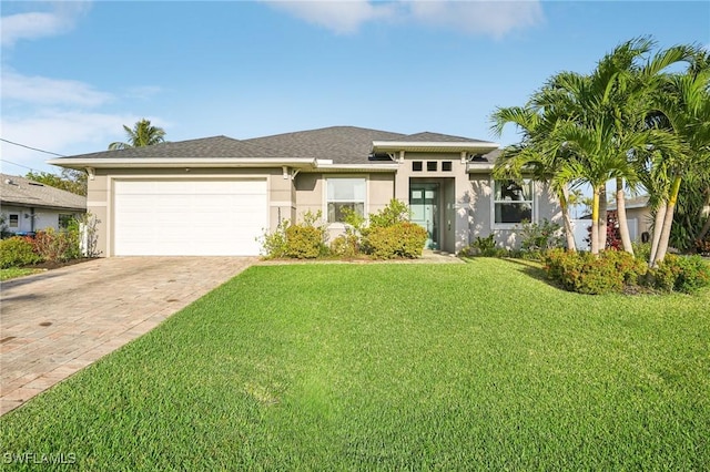 view of front facade featuring a garage and a front lawn