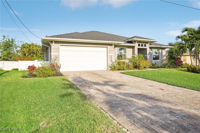 view of front facade featuring a front yard and a garage