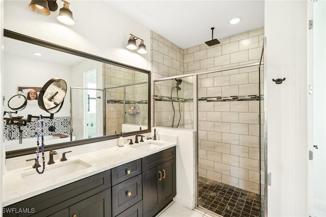 bathroom featuring vanity and an enclosed shower