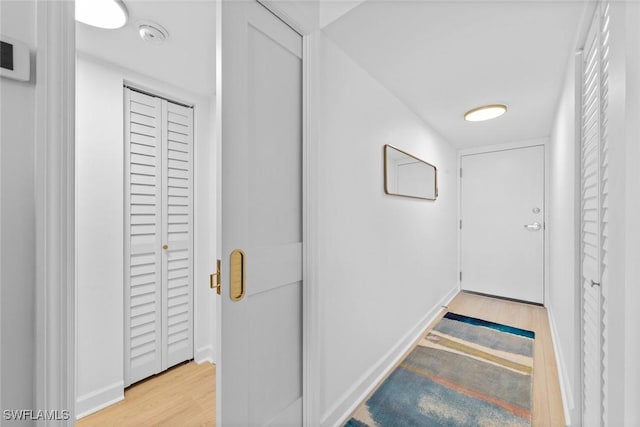 hallway featuring light hardwood / wood-style flooring