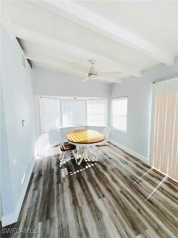 unfurnished dining area with beam ceiling, ceiling fan, and dark wood-type flooring