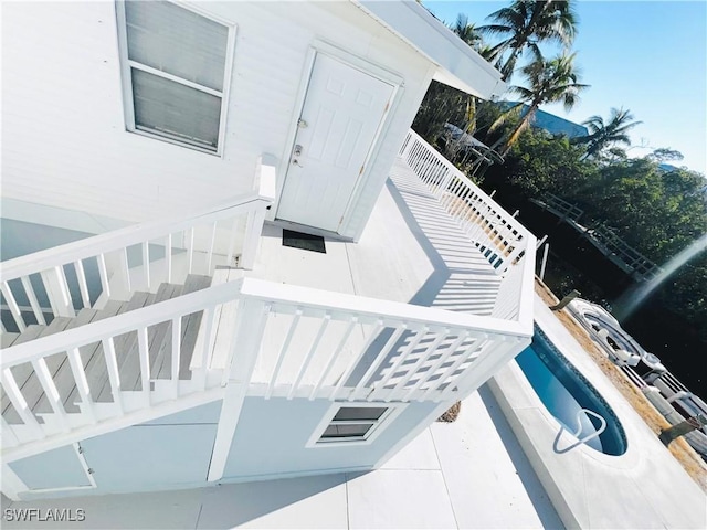 property entrance with a pool