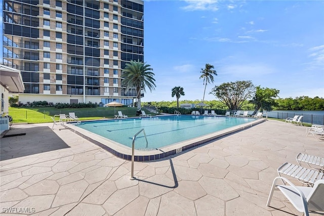 view of swimming pool featuring a patio