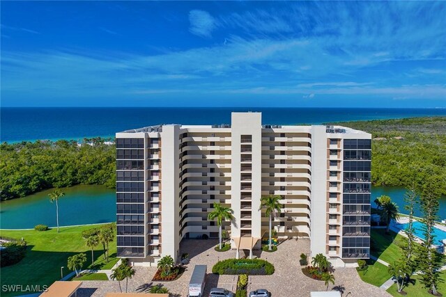 view of building exterior with a water view