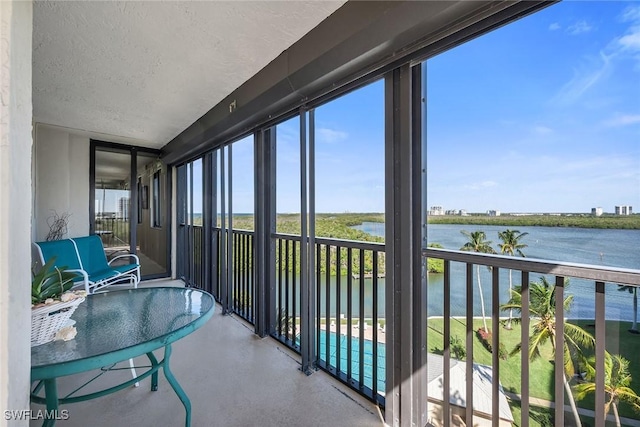 sunroom with a water view