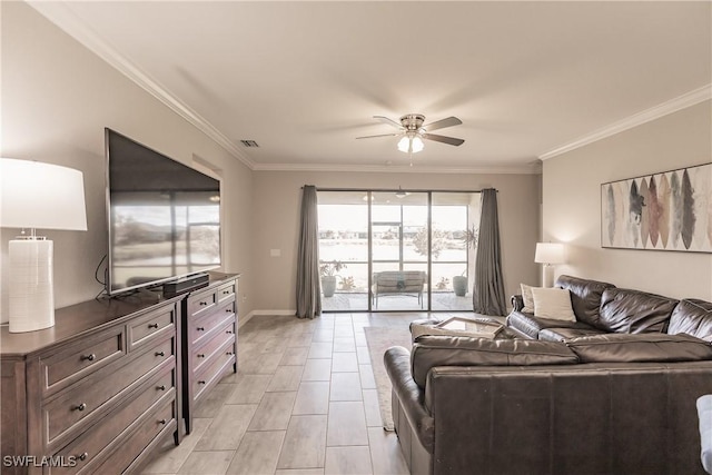 living room with ceiling fan and ornamental molding