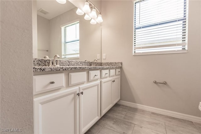 bathroom featuring tile patterned floors and vanity