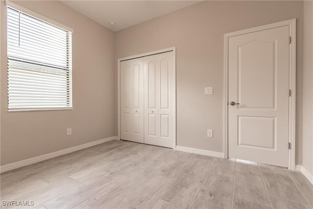 unfurnished bedroom with a closet