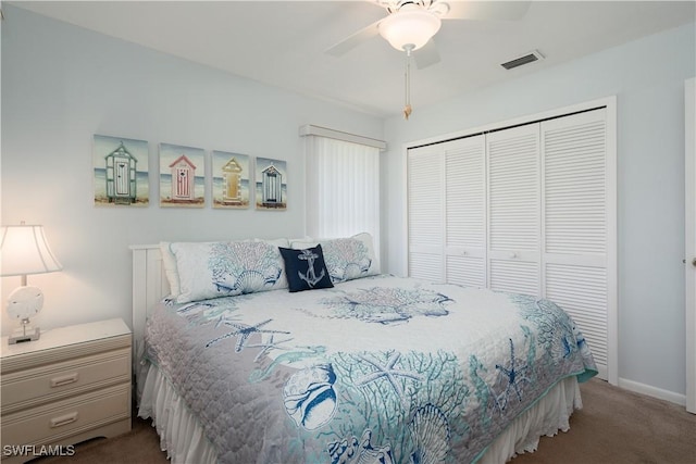 carpeted bedroom with ceiling fan and a closet