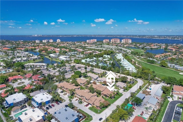 birds eye view of property with a water view