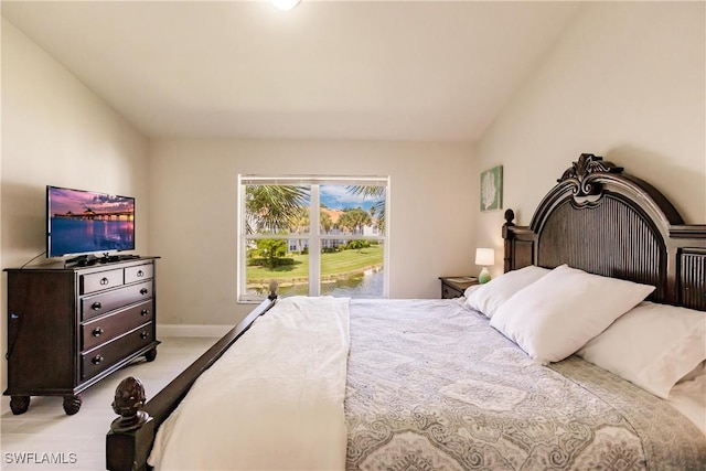 bedroom with lofted ceiling