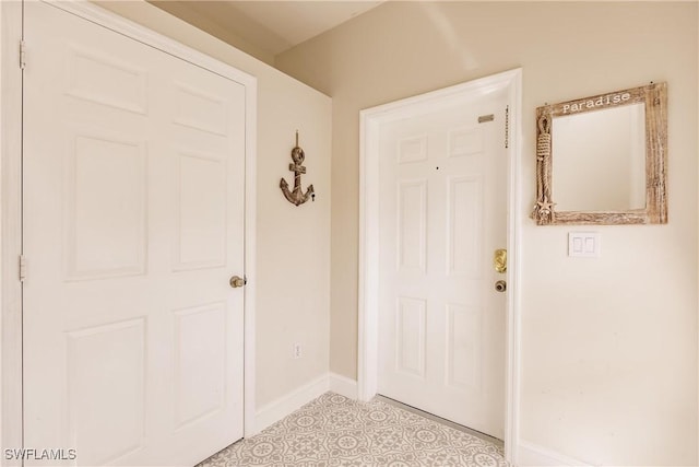 entryway featuring light tile patterned flooring