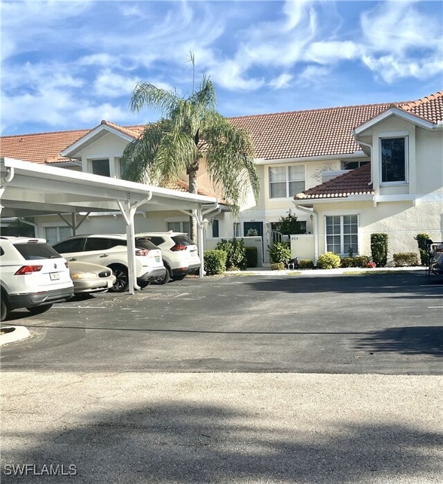 exterior space featuring a carport