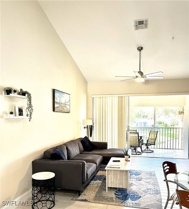 living room with high vaulted ceiling and ceiling fan