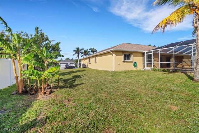 view of yard with a lanai