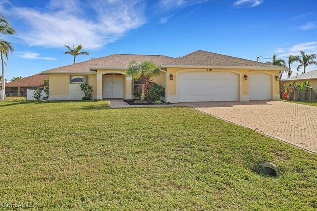 ranch-style house with a front yard and a garage