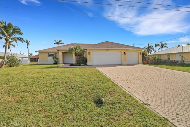 ranch-style home with a garage and a front yard