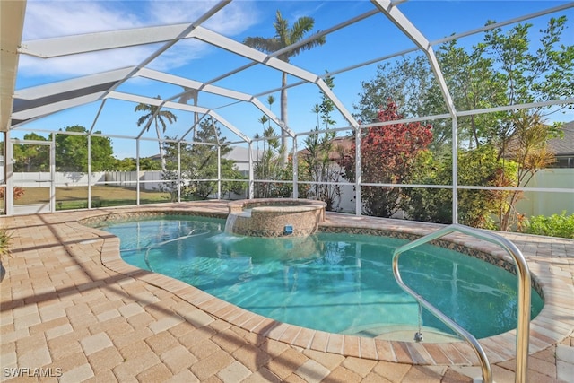 view of swimming pool with a patio area, glass enclosure, and an in ground hot tub