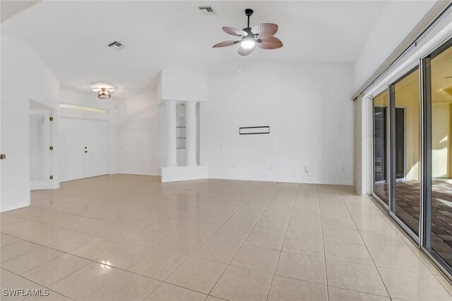 unfurnished room featuring ceiling fan and light tile patterned floors