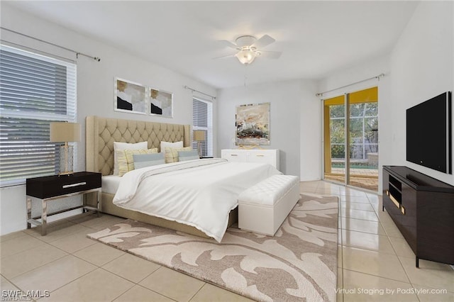 bedroom featuring tile patterned floors, a ceiling fan, and access to exterior