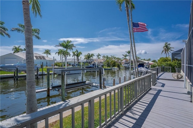 dock area featuring a water view and a lanai