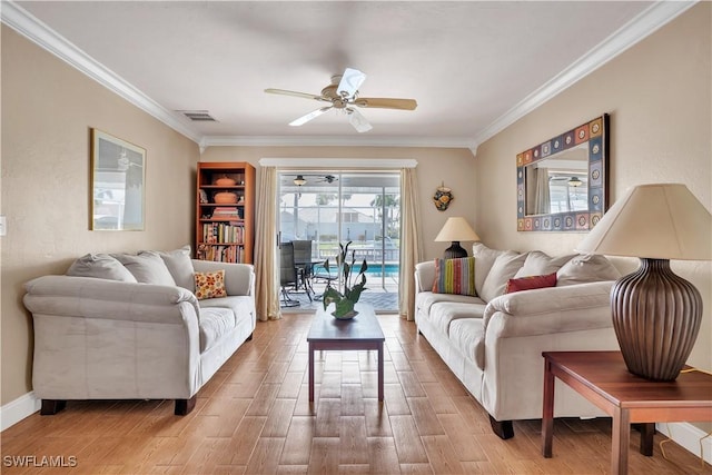 living room with crown molding and ceiling fan