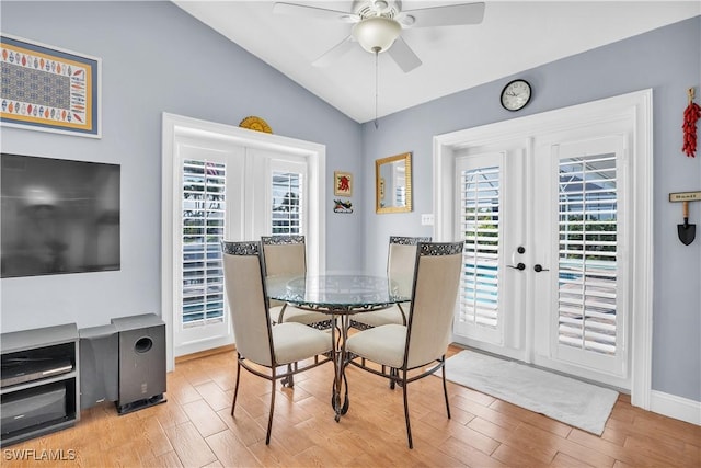 dining space with french doors, ceiling fan, and lofted ceiling