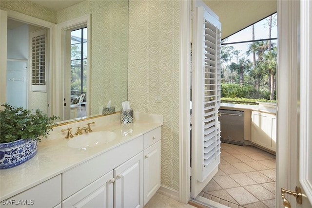 bathroom featuring tile patterned flooring and vanity