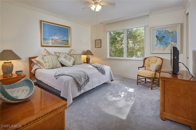 bedroom with carpet, ceiling fan, and crown molding