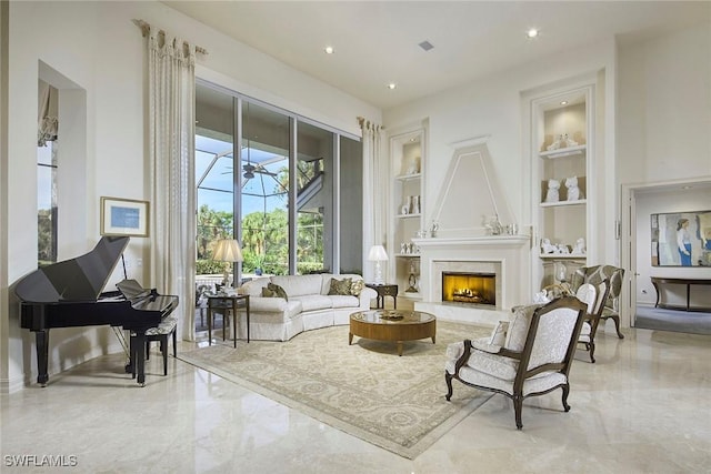 living room featuring a fireplace and built in features