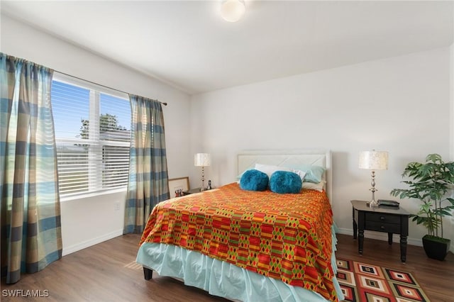 bedroom featuring dark hardwood / wood-style floors