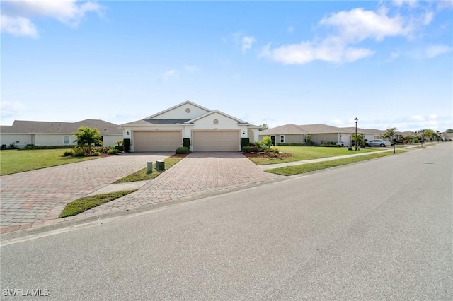 single story home featuring a garage and a front lawn