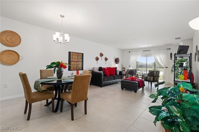 tiled dining area with a chandelier