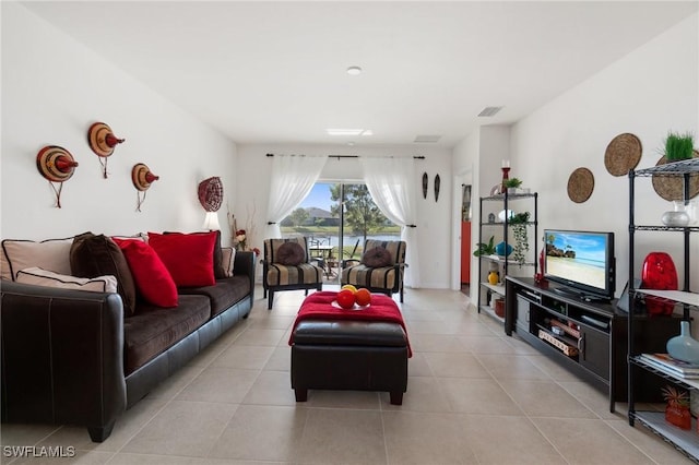 living room with light tile patterned flooring