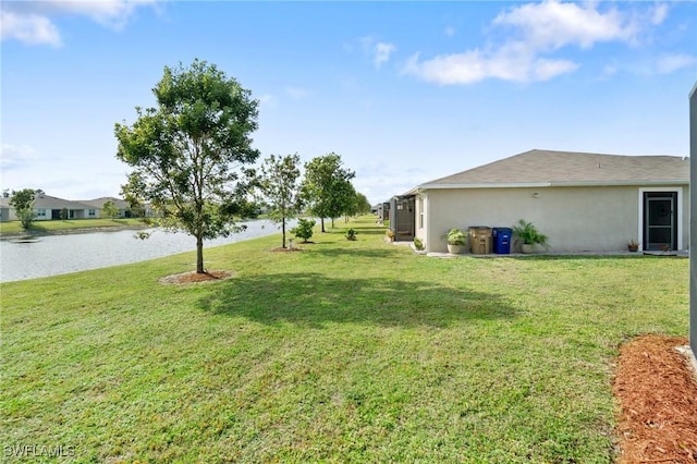 view of yard with a water view