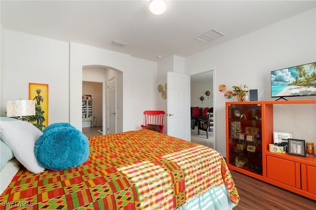 bedroom with wood-type flooring