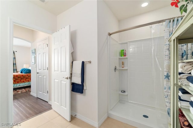 bathroom featuring tile patterned floors and walk in shower