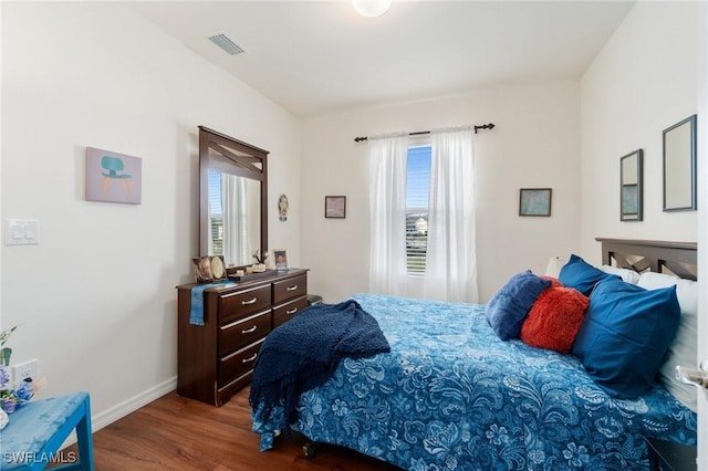 bedroom with wood-type flooring