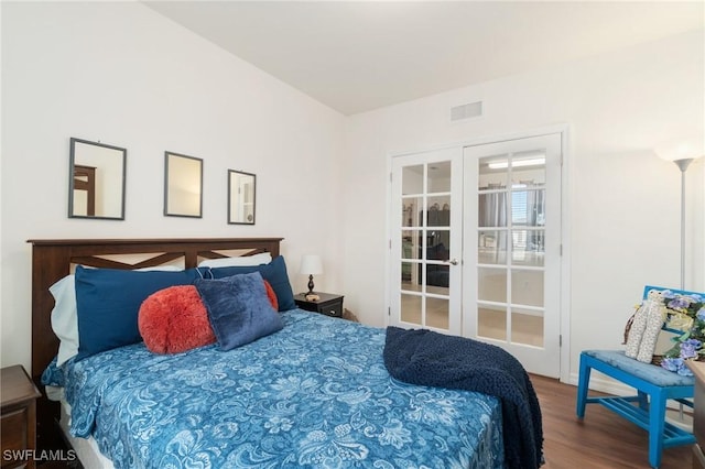 bedroom featuring wood-type flooring and french doors