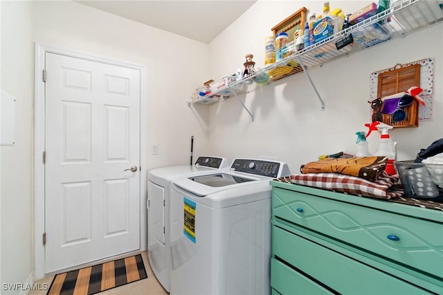 clothes washing area with washer and dryer