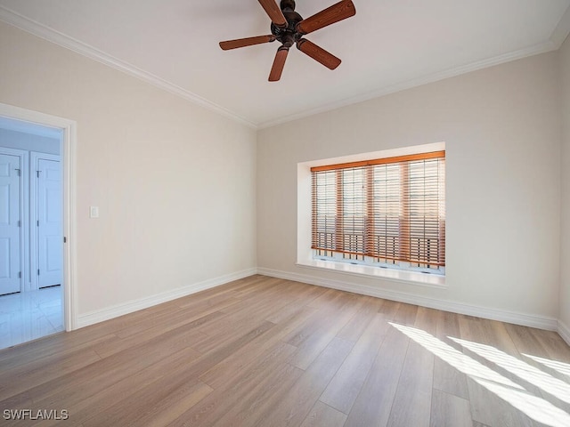 empty room with light wood-type flooring, ceiling fan, and crown molding