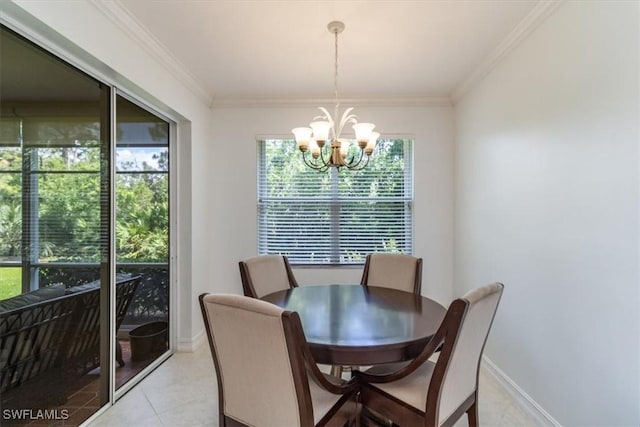 dining room featuring plenty of natural light, ornamental molding, and a chandelier