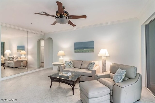 living room with ceiling fan and crown molding